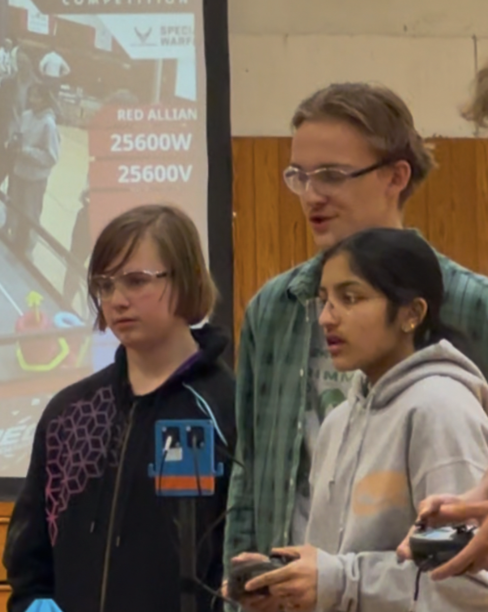 Members of Team Mayday (L-R: Eli Smith '28, Nikka Souza '26, Aryaa Mutha '26)